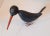 Arts and Crafts era, folkart wooden long bill bird, with glass eyes and metal feet. No artist mark, but hand painted and...