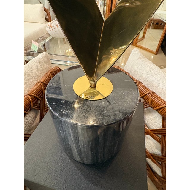 Vintage Signed Curtis Jere Eternal Flame Brass statue mounted on marble base. Dimensions: 52 H x 12 W x 8 D.