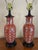 Sweet pair of vintage ginger jar style lamps. Hand painted white cherry blossoms bloom over a rich, persimmon glazed body...