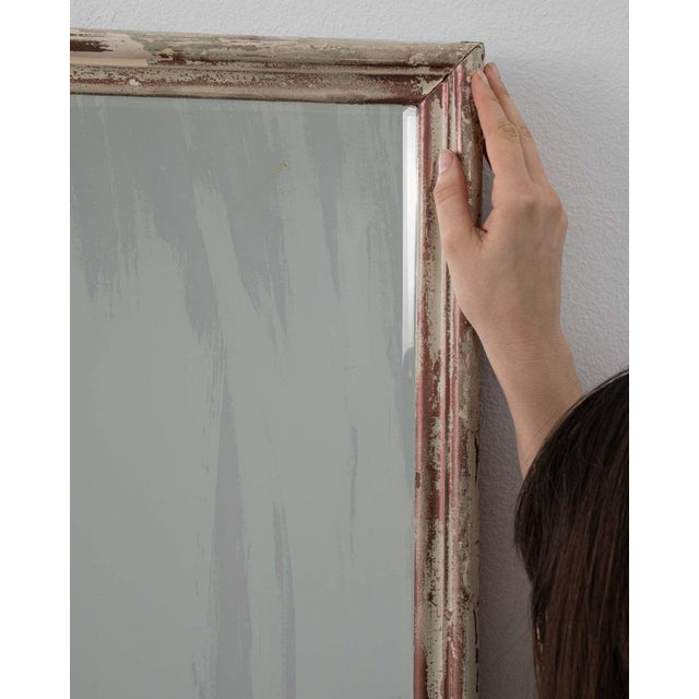 A mirror whose whitewashed distressed frame, rectangular gives it real character at first glance. The piece dates to...