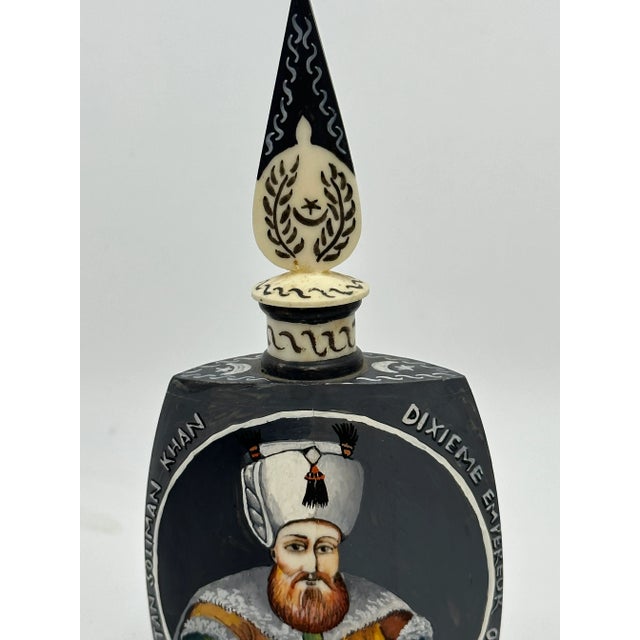 Hand Painted Emoror Otho Carved Bottle with Stopper. This is an exquisite piece that is hand painted with much detail on...