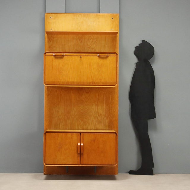 Vintage 1960s storage cabinet made of maple veneer wood, representing a classic example of the era's functional design....
