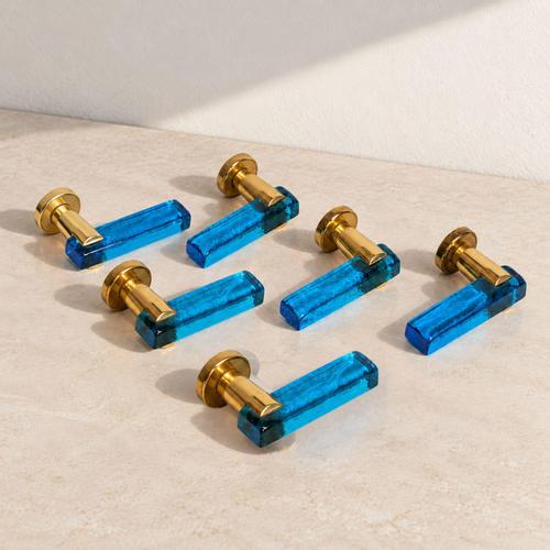 A set of six Italian door handles from the 1970s, crafted from deep blue Murano glass with brass mounts and details. Each...