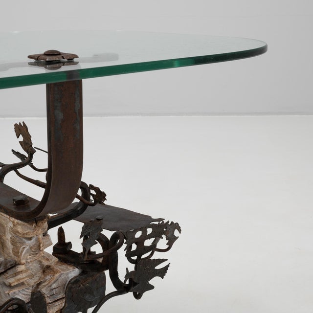 1900s Asian wrought iron coffee table featuring intricate figural and botanical motifs, showcasing exceptional...