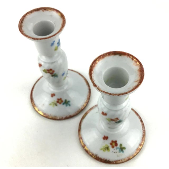 Lovely floral painted pair of candle holders. These are most likely from the 60’s and will add style to your space. I just...
