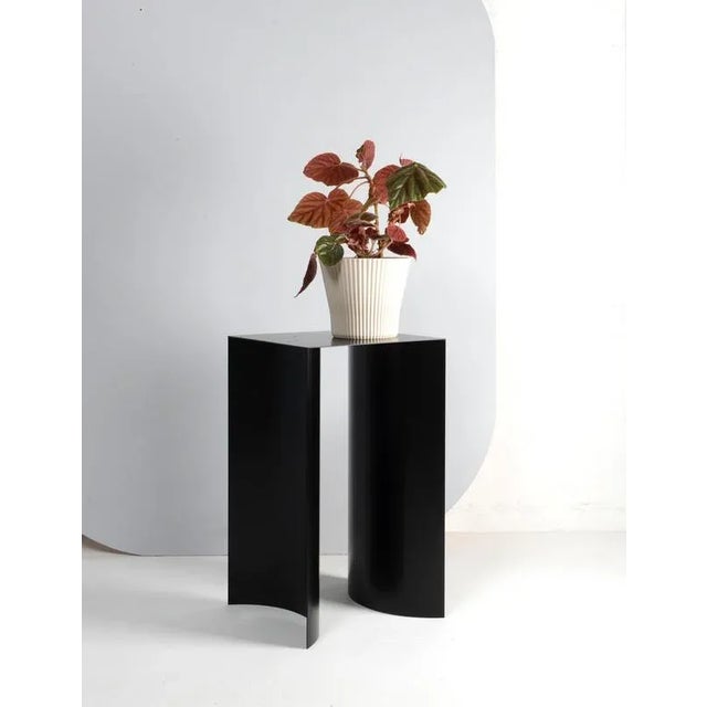 Black arc table by ok design dimensions: d 35 x w 35 x h 60 cm. Materials: powder-coated metal.