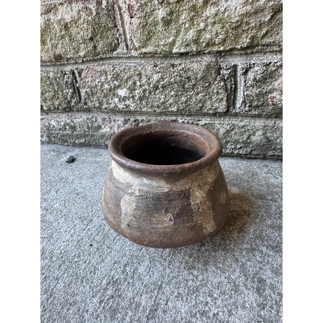Vintage brown and ivory Indian ceramic pot. This piece is mounted on a custom metal ring so that the pot does not tip or...