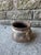 Vintage brown and ivory Indian ceramic pot. This piece is mounted on a custom metal ring so that the pot does not tip or...