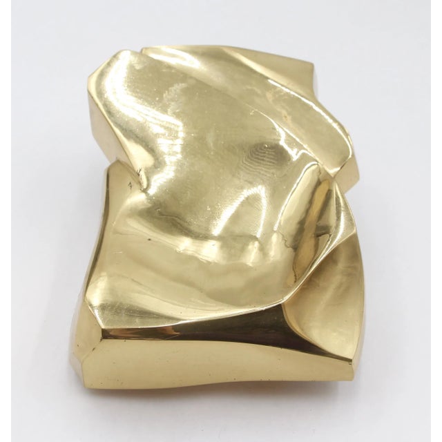 Vintage European Modern style door pull with a sculptural folded surface. This is made of brass with a polished finish....