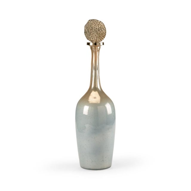 Elegant and contemporary, helsinki bottle is crafted of sleek art glass with an ombre finish. The blue, silver and amber...
