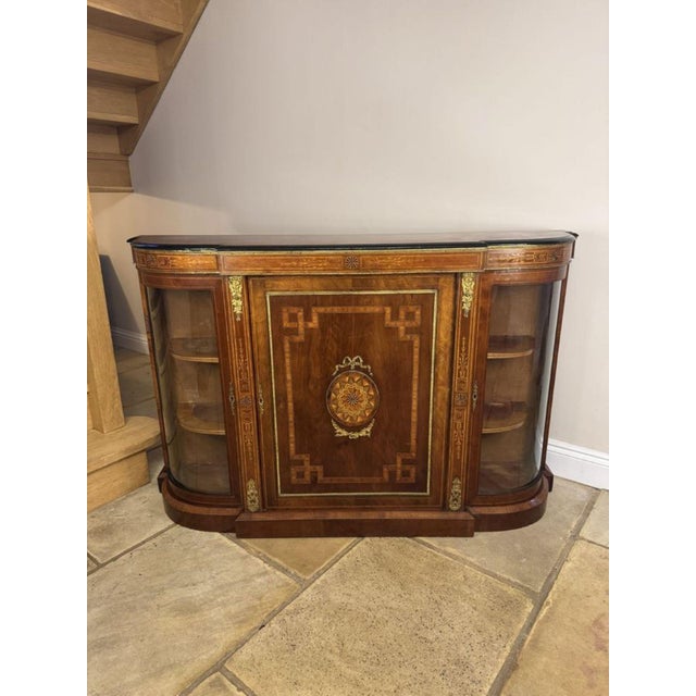Outstanding quality antique Victorian walnut inlaid credenza, having a quality richly polished walnut inlaid antique...