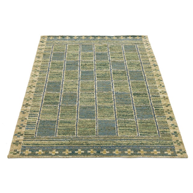 Enhance your space with this hand-woven flatweave rug, inspired by mid-century Swedish kilim designs. Made from durable...