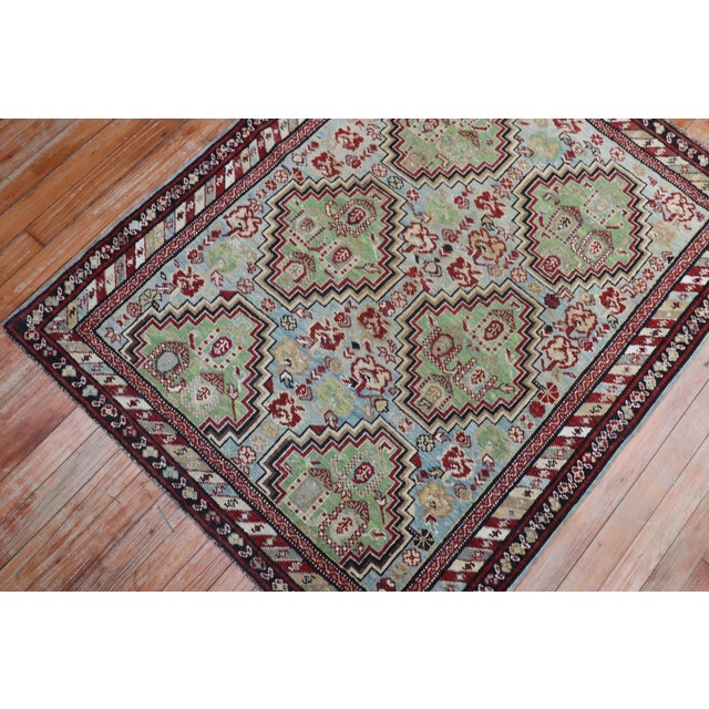 A late 19th century antique Caucasian Baku Khila rug with 6-light green medallions (2 of the medallions are half full) on...