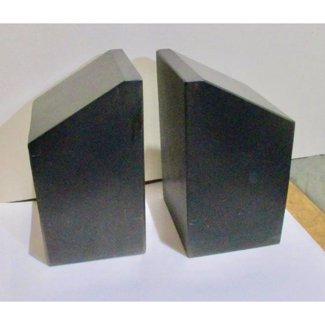 Great pair of cut black granite blocks in tall block modern form. The matte or honed finish on the top and three sides...