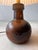 A unique ceramic table lamp from Denmark, handmade in the 1960s. Its minimalist shape and warm earth tones make this lamp...