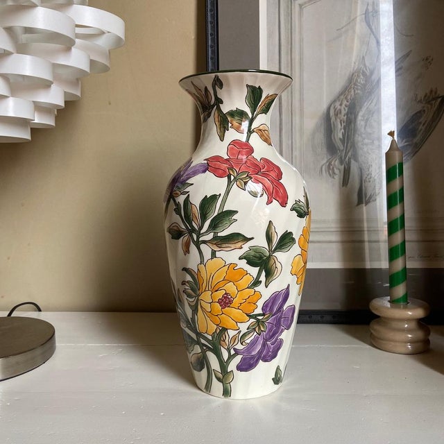 Bring a touch of classic French elegance into your home with this exquisite vintage faience vase from the renowned...