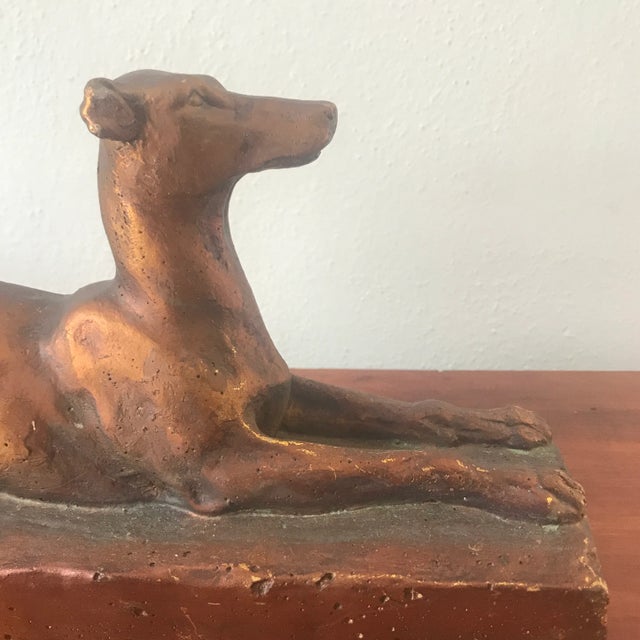 We wish we knew what this fun little pup was used for! He appears to be made of resin and has two threaded holes down one...