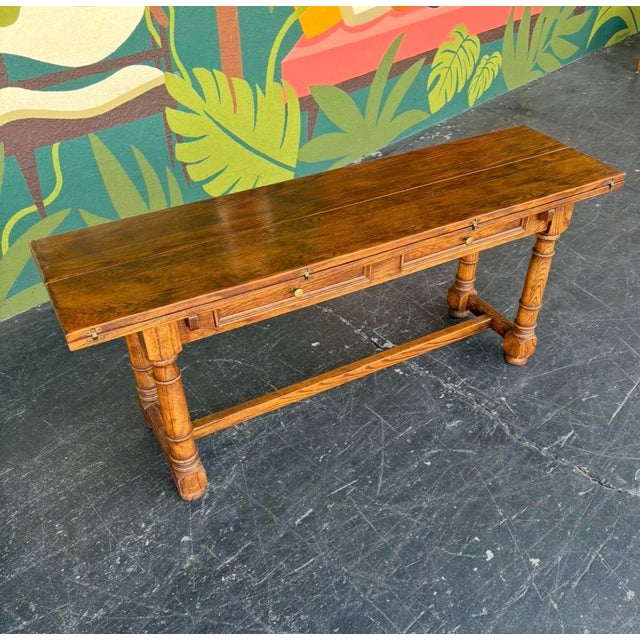Hefty, well-made, Century flip top console table that easily converts into a dining table. Versatility is the name of the...