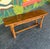 Hefty, well-made, Century flip top console table that easily converts into a dining table. Versatility is the name of the...