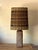 Monumental textured terracotta lamp with impeccable Maria Kipp woven shade. The dimensions listed (18 in. diameter x 41...