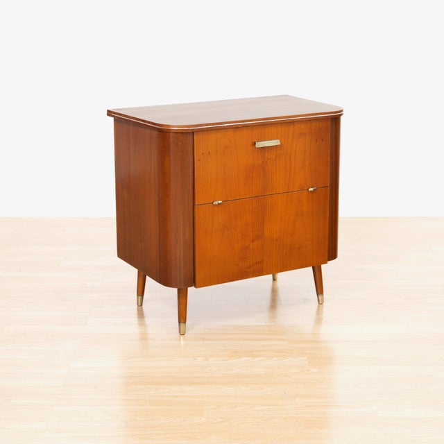 A beautifully proportioned British mid-century liquor cabinet dating from the 1960s, combining clean modern lines with...