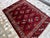This exquisite high-quality hand-knotted wool area rug showcases a traditional Turkmen Yomut tribal design. The striking...