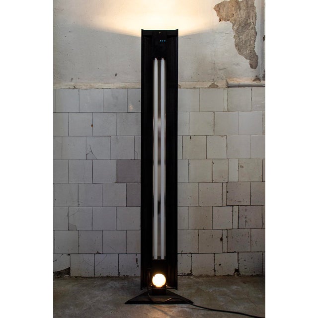 Three-light metal floor lamp, halogen and fluorescent. Manufacturer: Status 1990s This piece has an attribution mark, I am...