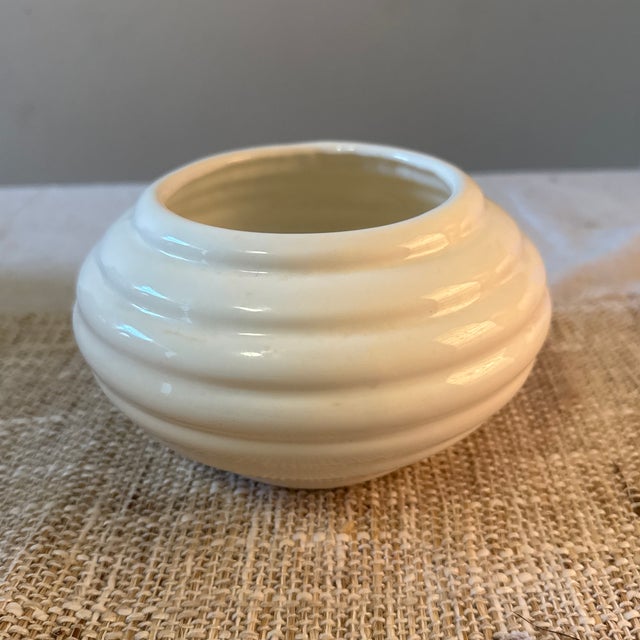 Add a touch of vintage sophistication to your space with this stunning Haeger White Art Deco Vase. Crafted by Haeger...
