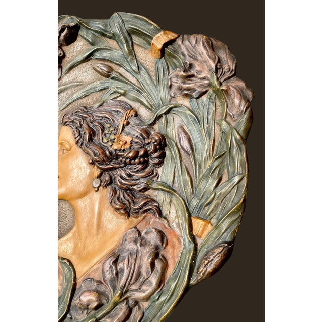 A stunning antique Art Nouveau (Jugendstil) polychrome porcelain bas-relief wall charger created by the Ernst Wahliss...