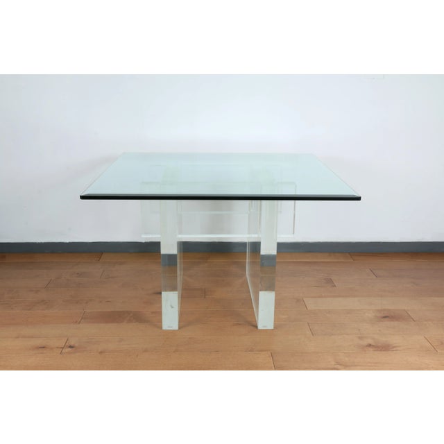 Vintage thick lucite Charles Hollis Jones table with glass top. Very heavy lucite base with well kept glass top. No broken...