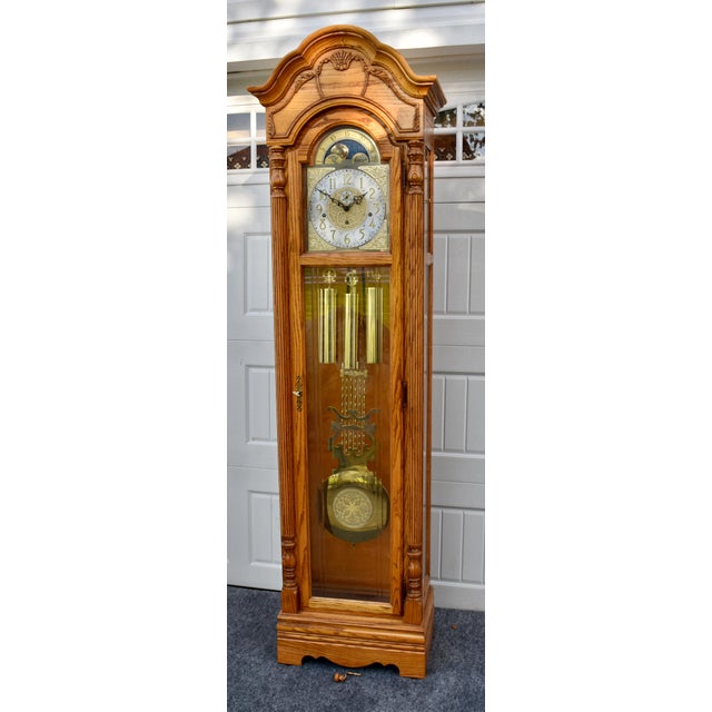 Vintage (1990's) Howard Miller Grandfather Clock. Model # 610-754. The Wood is Oak. Tall Case, Beveled Glass, Weight,...