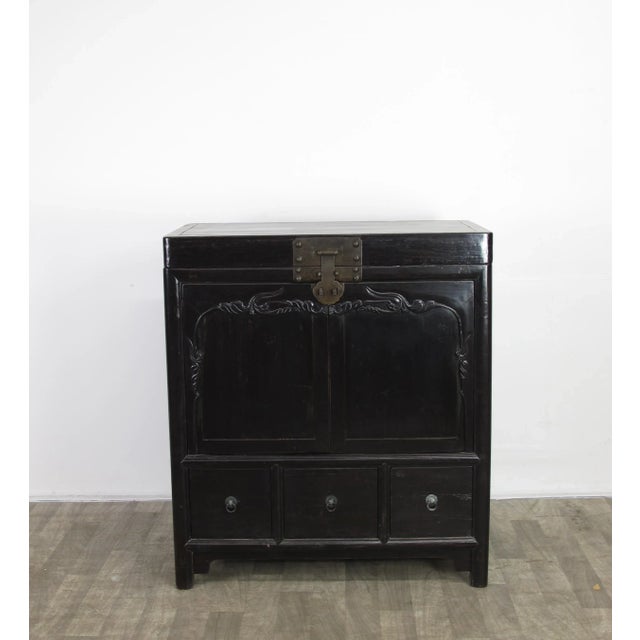 This gorgeous cabinet was converted from a trunk at some point of its life. There is one compartment on the top that can...