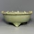 Fine antique Chinese celadon tripod bowl. Three short supporting feet, foliate rim with raised studs, relief motif inside...