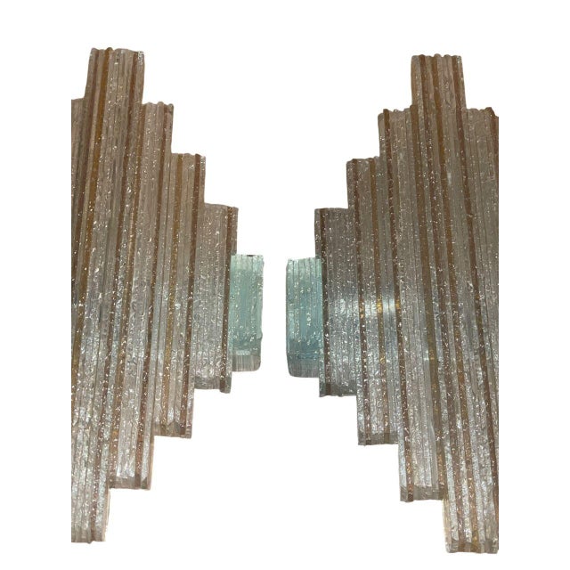 An exceptional pair of sculptural wall sconces designed by Albano Poli for Poliarte, the celebrated Murano lighting...