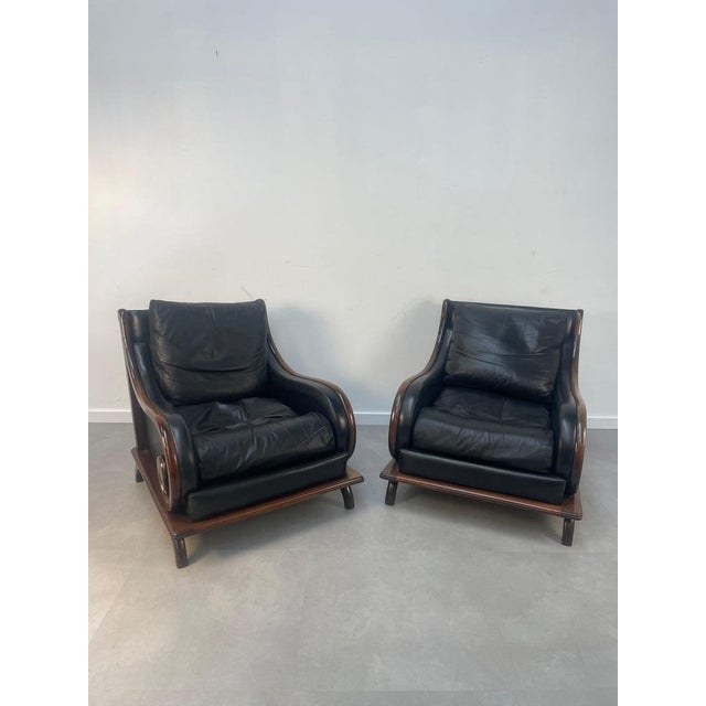 Super comfortable relaxchair in black leather with feather cushions. 80 x 80 cm.