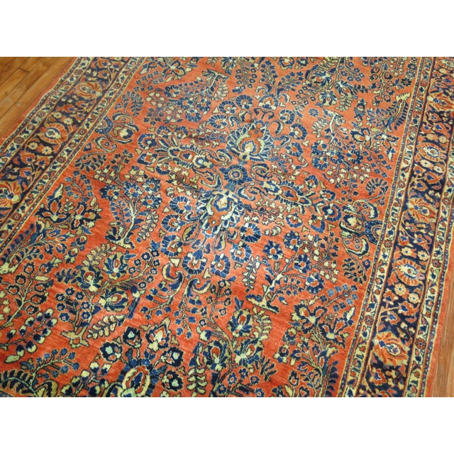 An early 20th century rare size Persian Sarouk rug. Measures: 6' x 8'11''.