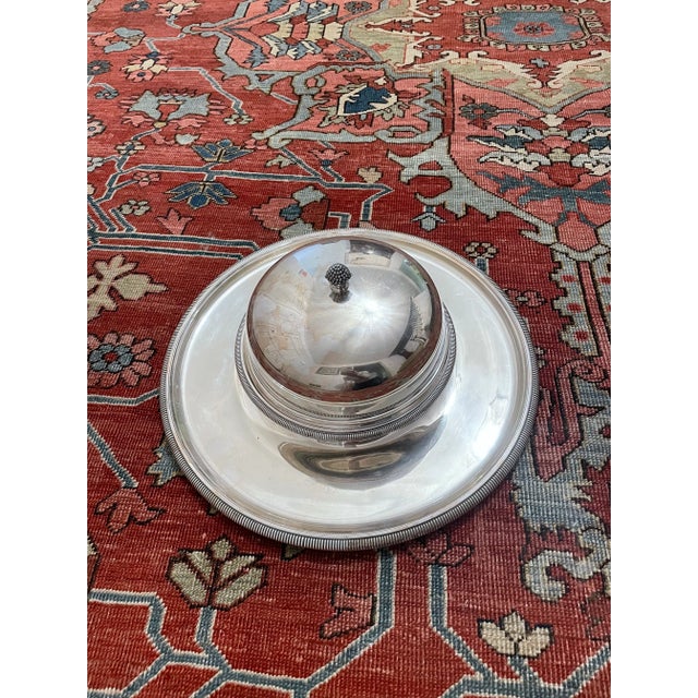 Beautiful large silver plated serving dish with attached covers bowl. Both pieces marked with makers mark. Perfect for...