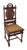 Dark wood tone carved English Renaissance style chairs with a wicker seat. Each chair back has a different carved figural...