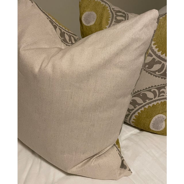 A pair of large scale medallion motif in mustard/gold and taupe/gray custom euros. 24" square with down inserts.