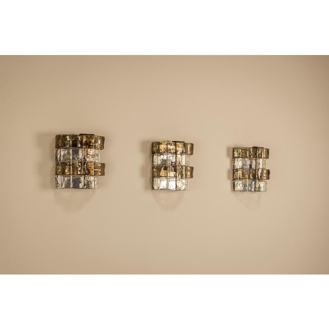 A refined interplay of glass and glow, this set of three LP 277 wall lights exemplifies Carlo Nason’s approach to lighting...