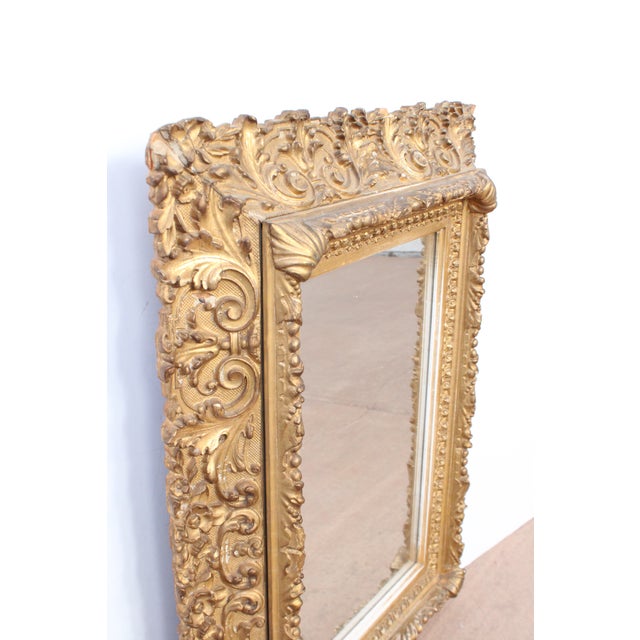 Exceptional 19th C. French carved wall mirror. Intricate carvings throughout. Being sold as found in it's authentic...
