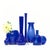 Cobalt glass vessels, group of 7. A unique assortment of mid-century glass vases and pieces in a cobalt blue color....