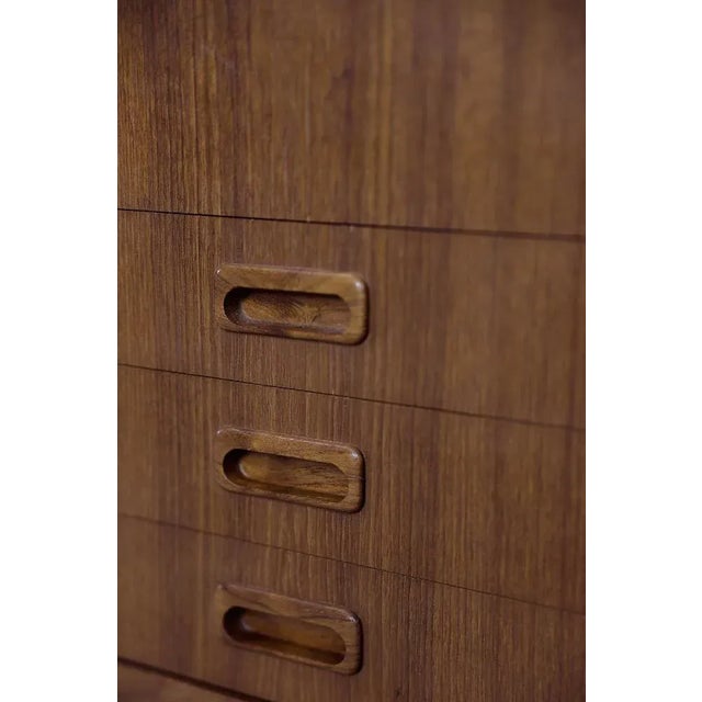 This sideboard was made in Sweden, probably in 1964. It is finished with teak wood with a warm color and regular graining....