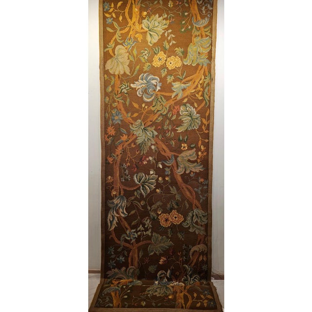 A beautiful early 20th century French needlepoint runner featuring a graceful and symmetrical Tree of Life design of...