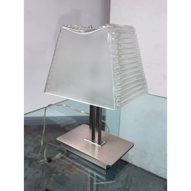 Design Plus Gallery presents the Kimilla Table Lamp, designed in 2003 by Umberto Asnago for Penta. This table lamp...