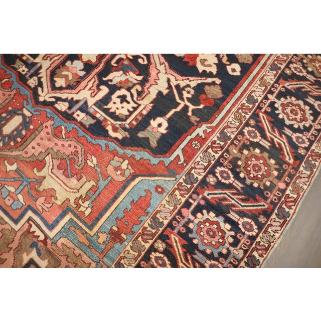 A room size masculine antique Persian Heriz rug from the 1st quarter of the 20th century Measures: 8'8'' x 12'2''...