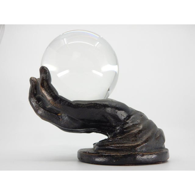 Vintage life-size bronze hand holding a 4" crystal ball. Glass ball fits firmly in hand but not attached. Fabolous...