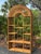 Bring timeless coastal charm to your home with this beautiful 1970s vintage wicker étagère. Featuring a gracefully arched...