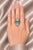 Stunning 18K white gold Art Deco mosaic statement ring featuring a natural emerald centerpiece, accented with hand-cut...
