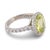 This striking sapphire and diamond ring showcases a rare and captivating greenish-yellow sapphire, certified by GIA and...